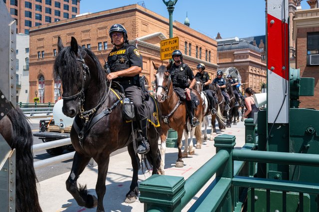 Police mov outside of the Republican National Convention (RNC) on the fourth and final day of the event on July 18, 2024 in Milwaukee, Wisconsin. Security throughout downtown Milwaukee remains high following the assassination attempt on former President Donald Trump over the weekend. Thousands of delegates, politicians and the Republican faithful have arrived into the traditionally Democratic city for the annual convention which will conclude with former President Donald Trump accepting his party's presidential nomination. The RNC takes place from July 15-18. (Photo by Spencer Platt/Getty Images)