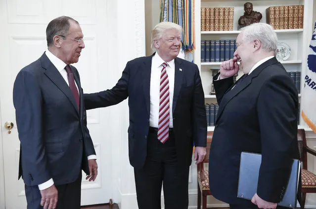 Russia’s Foreign Minister Sergei Lavrov, left, President Trump, and Russian Ambassador to the United States Sergei Kislyak talk during a meeting in the Oval Office at the White House in Washington DC, USA on May 10, 2017. (Photo by Alexander Shcherbak/TASS)