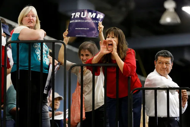 Supporters of Republican U.S. presidential candidate Donald Trump shout encouragement as law enforcement officials remove two men from the crowd before Trump takes the stage to rally in Albuquerque, New Mexico, U.S. May 24, 2016. (Photo by Jonathan Ernst/Reuters)