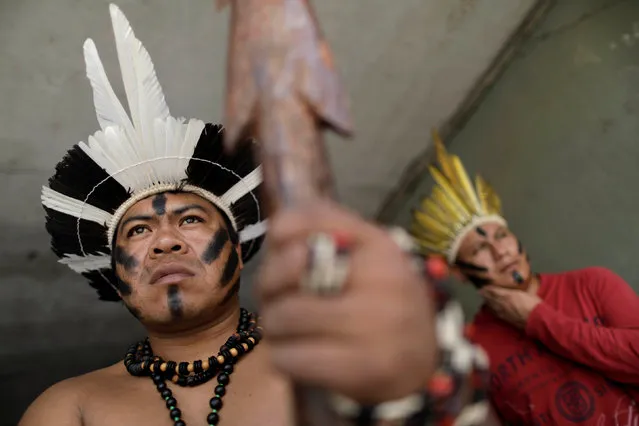 Indigenous people of southern Brazil take part in a protest against the report of the parliamentary commission of inquiry that investigates fraud and irregularities in the process of demarcation of indigenous lands, made by National Indian Foundation (Funai) and National Institute of Colonization and Agrarian Reform (Incra), in Brasilia, Brazil May 16, 2017. (Photo by Ueslei Marcelino/Reuters)