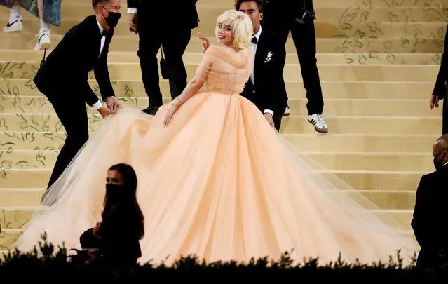American singer and songwriter Billie Eilish shed her trademark baggy clothes for a plunging Oscar de la Renta peach gown she said was inspired by Marilyn Monroe at 2021 Met Gala Celebrating In America: A Lexicon Of Fashion at the Metropolitan Museum Of Art on September 13, 2021 in New York City. (Photo by Andrew Kelly/Reuters)