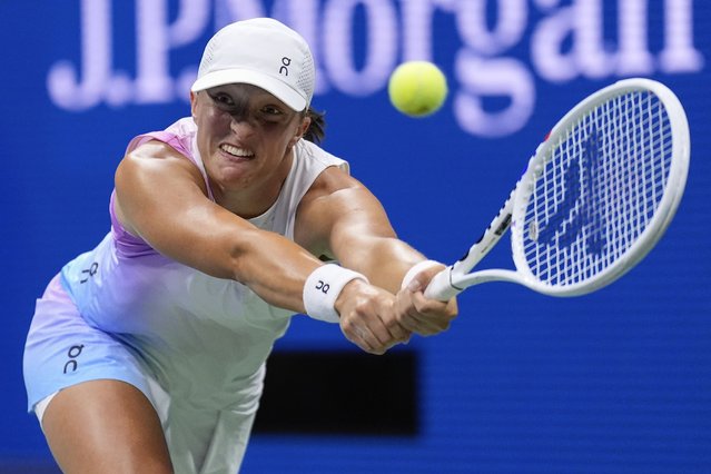 Iga Swiatek, of Poland, returns a shot to Anastasia Pavlyuchenkova, of Russia, during the third round of the U.S. Open tennis championships, Saturday, August 31, 2024, in New York. (Photo by Matt Rourke/AP Photo)