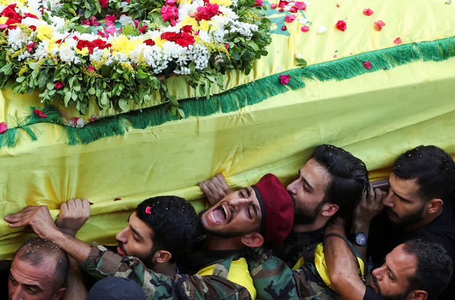 Men carry the coffin of Mohammad Mahdi Ammar, son of Hezbollah member of the Lebanese parliament, Ali Ammar, who was killed amid the detonation of pagers across Lebanon, during his funeral in Beirut, Lebanon on September 18, 2024. (Photo by Mohamed Azakir/Reuters)