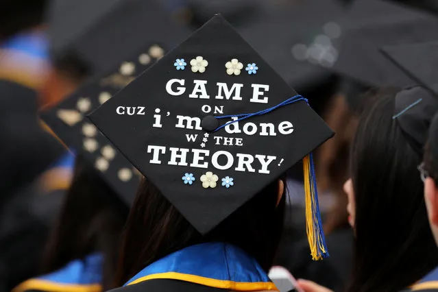 Graduating students place messages and artwork on the top of their caps as they attend their graduating ceremony at  UC San Diego in San Diego, California, U.S. June 17, 2017. (Photo by Mike Blake/Reuters)