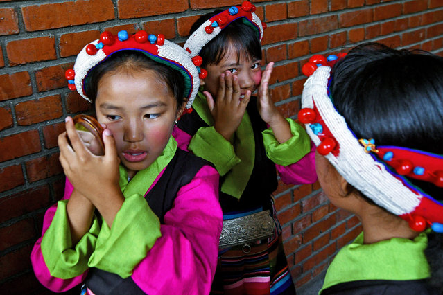 Exiled Tibetan children prepare to perform during the celebrations to mark the 88th birthday of spiritual leader the Dalai Lama at the Namgyal School in Kathmandu on July 6, 2023. (Photo by Prakash Mathema/AFP Photo)