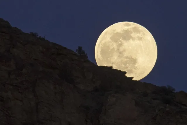 The full super snow moon rises, Saturday, February 8, 2020, at Smith Rock State Park in Oregon. (Photo by Ted S. Warren/AP Photo)