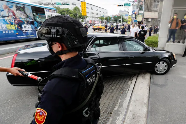 Taiwanese SWAT operatives stand next to the vehicle of US House Speaker Nancy Pelosi as it drives past to Jingmei Human Rights Cultural Park in Taipei, Taiwan, 03 August 2022. Pelosi, the highest ranking US official to visit the island in 25 years, began her visit in Taiwan despite strong warnings of military action from China against the visit. (Photo by Ritchie B. Tongo/EPA/EFE)