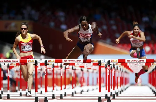 Tiffany Porter of Britain (C) competes in the women's 100 metres hurdles heats during the 15th IAAF World Championships at the National Stadium in Beijing, China August 27, 2015. (Photo by Lucy Nicholson/Reuters)