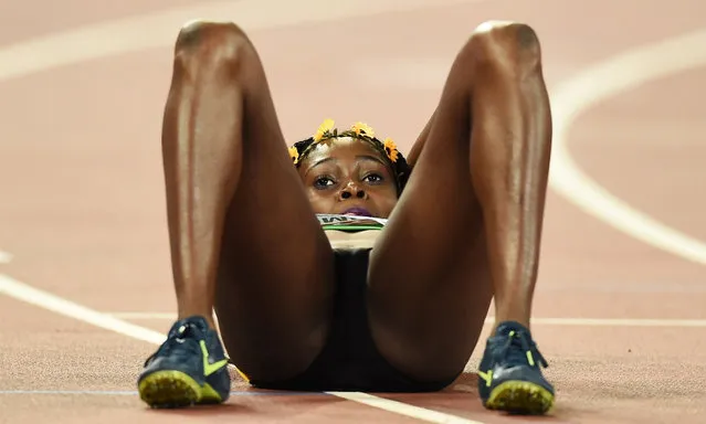 Elaine Thompson of Jamaica lies on the track after finishing in second place women's 200 metres final during the 15th IAAF World Championships at the National Stadium in Beijing, China August 28, 2015. (Photo by Dylan Martinez/Reuters)
