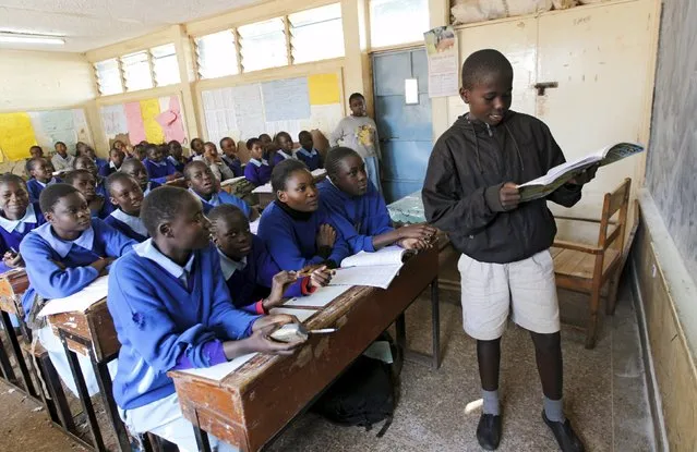 Pupils revise their class work without a teacher on the second week of a national teachers' strike, at Olympic Primary School in Kenya's capital Nairobi, September 9, 2015. (Photo by Thomas Mukoya/Reuters)