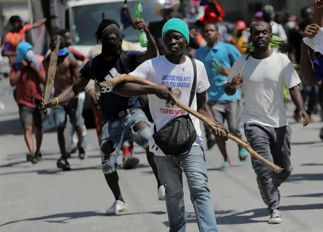 Demonstrators take part in a protest demanding the resignation of Prime Minister Ariel Henry, in Port-au-Prince, Haiti on September 11, 2022. (Photo by Ralph Tedy Erol/Reuters)