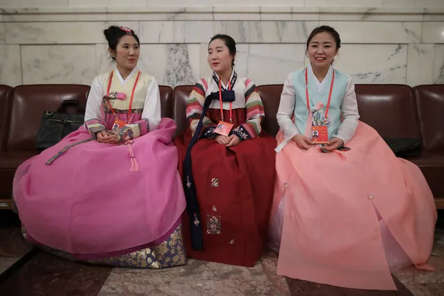 Chinese minority delegates wearing traditional costumes arrive for the opening ceremony of the 19th National Congress of the Communist Party of China (CPC) at the Great Hall of the People (GHOP) in Beijing, China, 18 October 2017. China holds the 19th Congress of the Communist Party of China, the country's most important political event where the party's leadership is chosen and plans are made for the next five years. Xi Jinping is expected to remain as the General Secretary of the Communist Party of China for another five-year term. (Photo by Wu Hong/EPA/EFE)