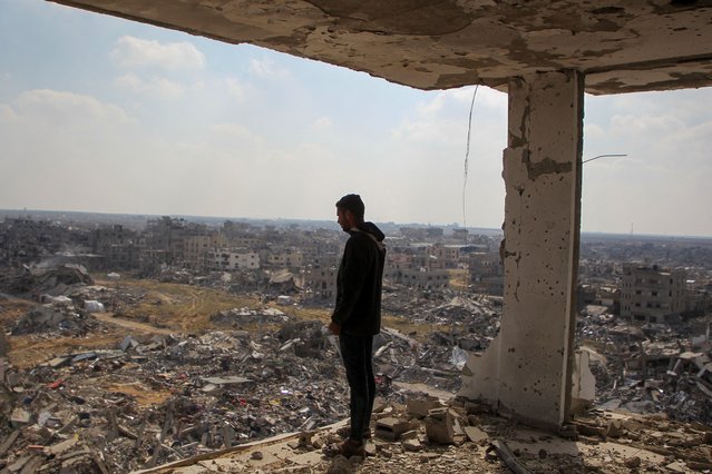 A Palestinian man views the rubble of buildings destroyed during the Israeli offensive, amid a ceasefire between Israel and Hamas, in Rafah in the southern Gaza Strip on February 4, 2025. (Photo by Hatem Khaled/Reuters)