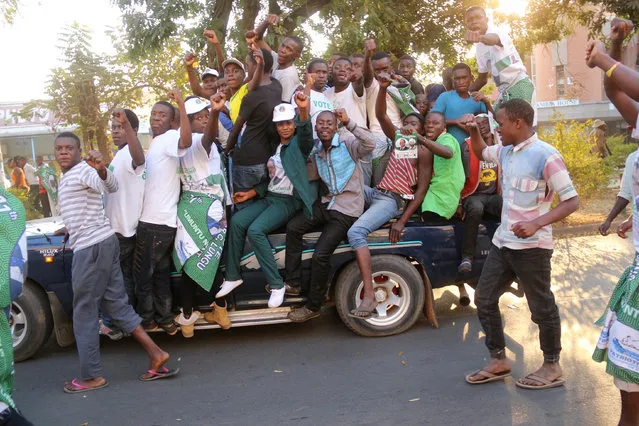 Supporters of Edgar Lungu, leader of the Patriotic Front party (PF), celebrate after Lungu narrowly won re-election on Monday, in a vote his main rival Hakainde Hichilema rejected on claims of alleged rigging by the electoral commission, in the capital, Lusaka, Zambia, August 15, 2016. (Photo by Jean Serge Mandela/Reuters)