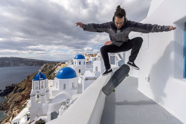 Local shopowner and amateur skateboarder Stavros Katsaros, 34, skates on the empty narrow streets of the village of Oia, as the seismic activity continues, on the island of Santorini, Greece, on February 22, 2025. (Photo by Nicolas Economou/Reuters)