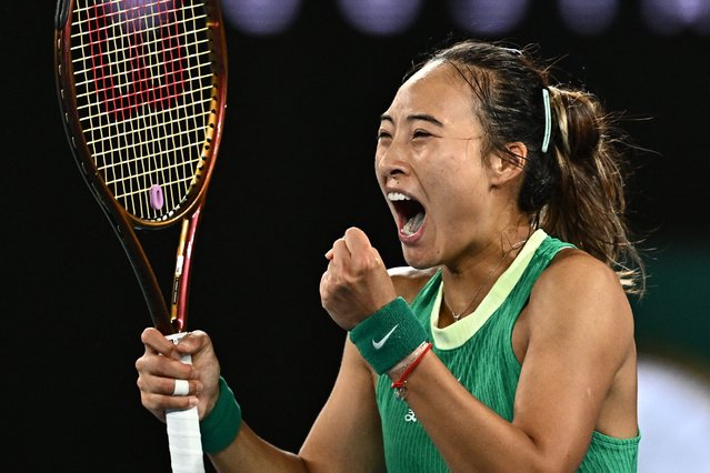 China's Zheng Qinwen celebrates a match point against Ukraine's Dayana Yastremska during their women's singles semi-final match on day 12 of the Australian Open tennis tournament in Melbourne on January 25, 2024. (Photo by Lillian Suwanrumpha/AFP Photo)