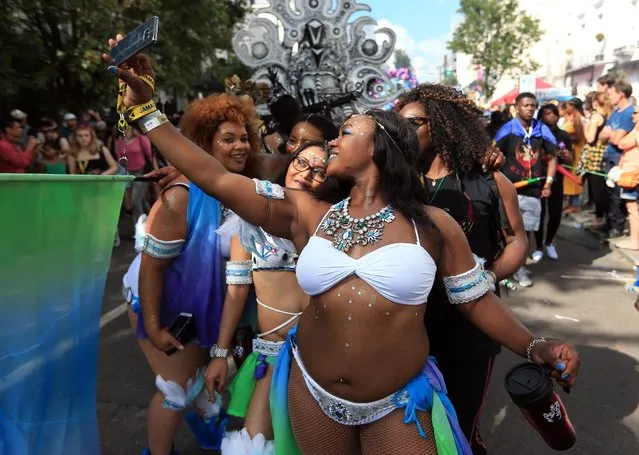 Dancers from the ELIMU float parade down Chepstow Road, during the second and final day of the Notting Hill Carnival, in London, Monday August  29, 2016. (Photo by Jonathan Brady/PA Wire via AP Photo)