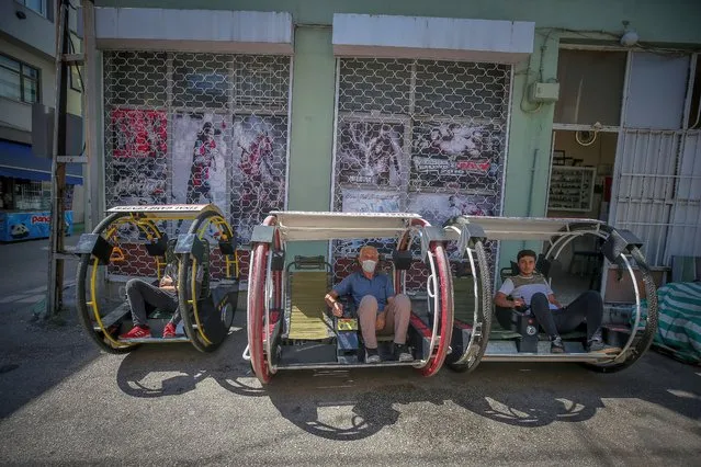 People drive two-wheeled electric vehicles in Bursa, Turkey on July 01, 2020. Hasan Duman, produced a two-wheeled electric vehicle with his relatives, and they gave name “Haciyatmaz” in Turkish which means bobo-doll in English. (Photo by Sergen Sezgin/Anadolu Agency via Getty Images)