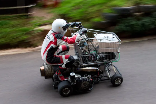 Matt Mckeown 55 drives the uphill course in his converted shopping trolley. Shelsley Walsh Hill Climb, Shelsley Walsh, Worcestershire, UK on September 04, 2016. This is the bizarre moment a petrol head competed in a motorcycle road race – in a jet-powered shopping trolley. Madcap Matt McKeown, 55, of Plymouth, Devon, build his wacky racer – which has a top speed of 80mph – from an abandoned cart he found in a ditch. He bolted on brakes, go-kart wheels and a 150 horsepower engine from a Chinook helicopter before taking it for time trials. Matt first set a record of 45.5mph then made several tweaks and broke his own record by reaching 71.4mph at Elvington Airfield in North Yorks. (Photo by Aaron Chown/SWNS.com)