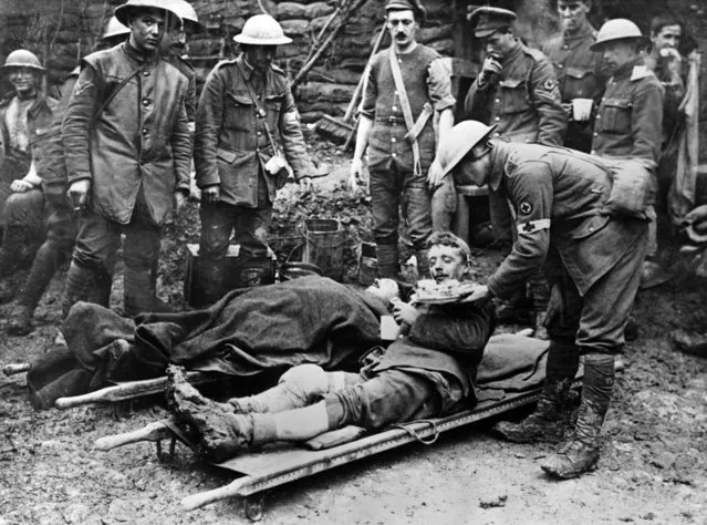 A field kitchen near Hamel in November 1916. Wounded British soldiers are given food before being taken to hospitals. (Photo by Camera Press/IWM)