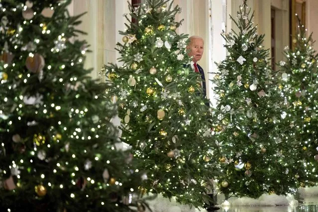US President Joe Biden arrives to deliver a Christmas address from the Cross Hall of the White House in Washington, DC, on December 22, 2022. (Photo by Brendan Smialowski/AFP Photo)