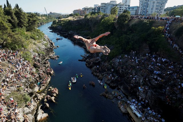 Evald Krnic makes a “swallow” style jump, from 23-meter-high Vizier bridge over Moraca river after 15 years of pause in traditional high diving competition in Podgorica, Montenegro, on July 19, 2025. (Photo by Stevo Vasiljevic/Reuters)