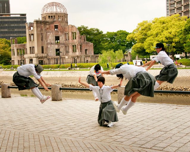 This image was taken purely by chance, when Fujioka happened to pass a group of schoolgirls striking a popular social media pose in Hiroshima in 2017. “I didn’t even notice the Atomic Bomb Dome (war memorial) behind them when I photographed this image – the girls probably didn’t either. The past and present of Hiroshima co-exists here, with a river running between”. (Photo by Aya Fujioka)