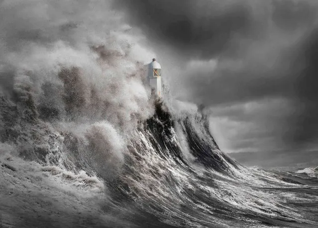 Drama at the Lighthouse, Wales. Your View category winner. A dramatic look at the power of the sea engulfing the lighthouse with huge waves. (Photo by Aleks Gjika/UK Landscape Photographer of the Year 2020)