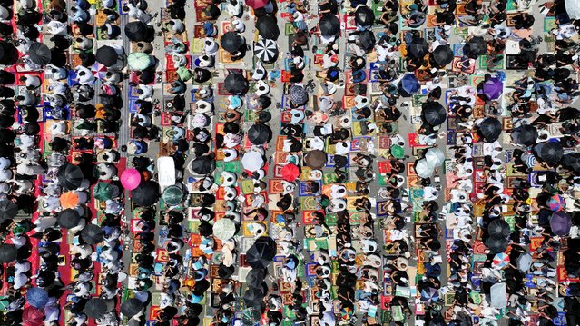 A drone view shows supporters of Iraqi Shi'ite cleric Moqtada al-Sadr gathering for Friday prayers during a protest against repeated violations of Iraqi airspace and to denounce attacks on Iran, amid the Iran-Israel conflict, in Basra, Iraq on June 20, 2025. (Photo by Mohammed Aty/Reuters)