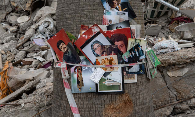 Family photos are hanged on the tree amid the rubble of collapsed building after the powerful twin earthquakes hit Turkiye's Kahramanmaras on February 20, 2023. On Feb. 06, a strong 7.7 earthquake, centered in the Pazarcik district, jolted Kahramanmaras and strongly shook several provinces, including Gaziantep, Sanliurfa, Diyarbakir, Adana, Adiyaman, Malatya, Osmaniye, Hatay, Kilis, and Elazig. Later, at 1.24 p.m. (1024GMT), a 7.6 magnitude quake centered in Kahramanmaras' Elbistan district struck the region. (Photo by Fatih Kurt/Anadolu Agency via Getty Images)