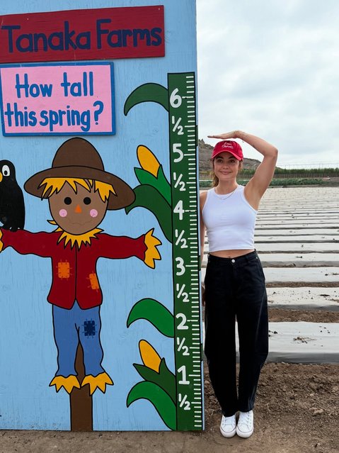 American actress Lucy Hale on September 16, 2025 pauses for a moment to check her height. (Photo by lucyhale/Instagram)