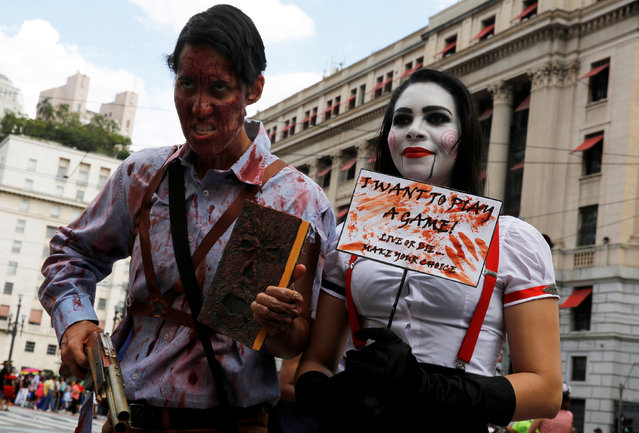 People participate in a Zombie Walk in Sao Paulo, Brazil, November 2, 2016. (Photo by Nacho Doce/Reuters)