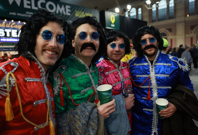 Fans dress in costume as they attend the World Darts Championships at Alexandra Palace in London London, Britain, 12 December 2025. The sporting event runs from 11 December 2025 to 03 January 2026. (Photo by Neil Hall/EPA)