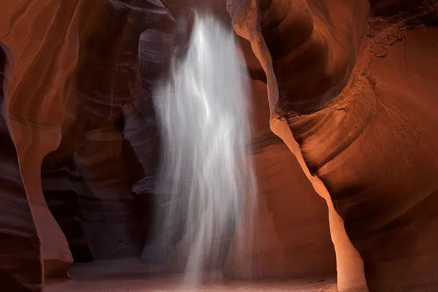 “Sand Spirit”. My son, Skye, named this image because he said that it looked like ghost floating in the air. I agreed with him, and thought it slightly ironic because the Navajo people who have permits to guide this canyon had closed it for the entire day. They closed Upper Antelope Canyon to bless it, and give back to the ancestors. Vern, our guide, informed us that they take from the canyon by profiting from the tour guides, and that sometimes they just need to give back to the spirits in the canyon. For some reason the wind was howling through the canyon the day after the blessing, and I got this shot. (Photo and caption by Matt Walker/National Geographic Traveler Photo Contest)