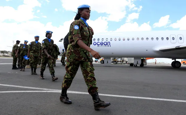 Kenya Defence Forces (KDF) soldiers, the first batch of the troops who had served in the U.N. peacekeeping mission in South Sudan, arrive at the Jomo Kenyatta international airport in Nairobi Kenya, November 9, 2016, after withdrawing in response to the sacking of their Kenyan commander of the UNMISS force following a U.N. inquiry. (Photo by Thomas Mukoya/Reuters)