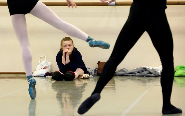 Students of the Krasnoyarsk state choreographic college take ballet lessons during the 4th International Forum “Ballet. XXI Century” at the State Opera and Ballet Theatre in Krasnoyarsk, Siberia,  Russia, November 11, 2016. (Photo by Ilya Naymushin/Reuters)