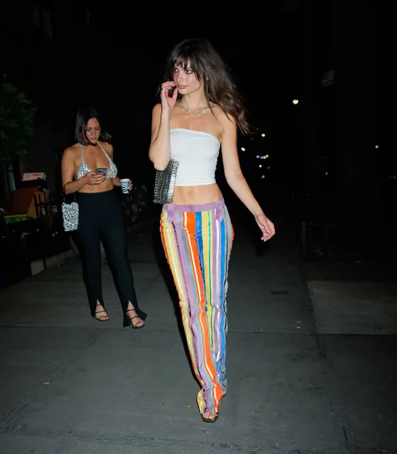 Emily Ratajkowski celebrates ahead of her 32nd birthday with friends in New York City on June 3, 2023. The American actress and model wore a white midriff bearing crop top paired with multi-colored, striped pants and heels. Emily's pants were were a perfect match to the six-color Pride Flag as we enter day four of the annual pride month. (Photo by The Image Direct)