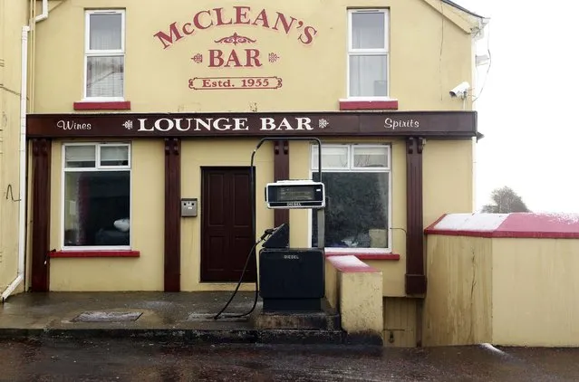 A fuel pump is seen in front of a Public House in the village of Malin in County Donegal, January 13, 2015. (Photo by Cathal McNaughton/Reuters)