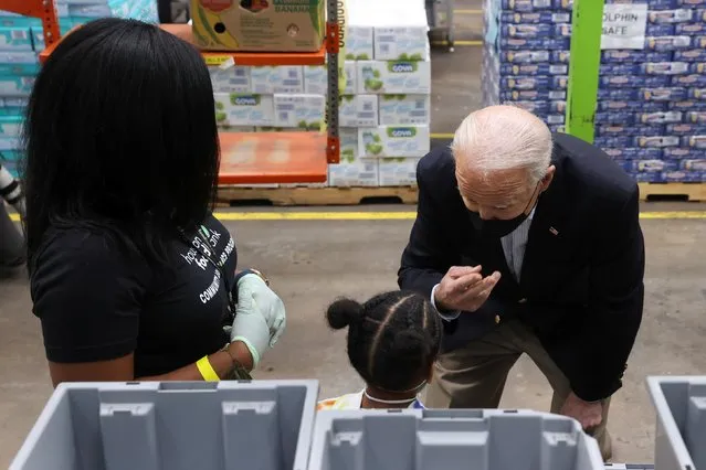U.S. President Joe Biden talks to a child as he visits the Houston Food Bank in Houston, Texas, U.S., February 26, 2021. (Photo by Jonathan Ernst/Reuters)