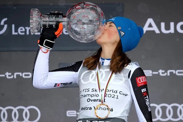 Slovakia's Petra Vlhova kisses the trophy of the alpine ski, women's World Cup overall title, in Lenzerheide, Switzerland, Sunday, March 21, 2021. (Photo by Marco Trovati/AP Photo)