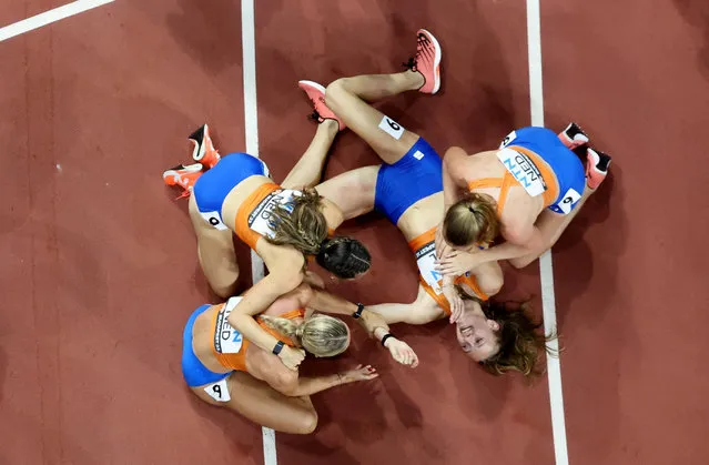 Gold medallists Netherlands' Femke Bol, Eveline Saalberg, Lieke Klaver and Cathelijn Peeters celebrate after winning the final 4x400 meters relay race on the last day of the World Athletics Championships in Budapest, Hungary on August 27, 2023. (Photo by Fabrizio Bensch/Reuters)
