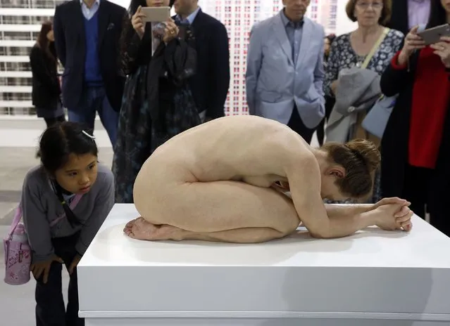 A young visitor looks at an artwork “Untitled” by Australian artist Sam Jinks at Art Basel's 2015 edition in Hong Kong March 13, 2015. (Photo by Bobby Yip/Reuters)