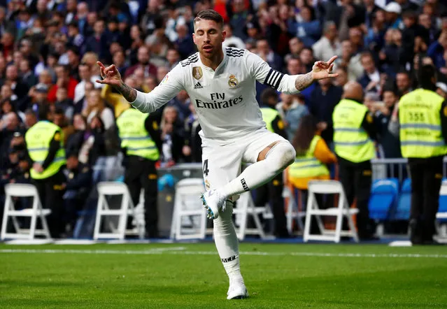 Real Madrid' s Spanish defender Sergio Ramos celebrates scoring his team' s second goal during the Spanish league football match between Real Madrid CF and Real Valladolid FC at the Santiago Bernabeu stadium in Madrid on November 3, 2018. (Photo by Juan Medina/Reuters)