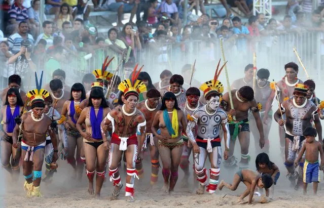 Members of Brazilian indigenous group Kuikuro dance during the XII Games of the Indigenous People in Cuiaba November 10, 2013. (Photo by Paulo Whitaker/Reuters)