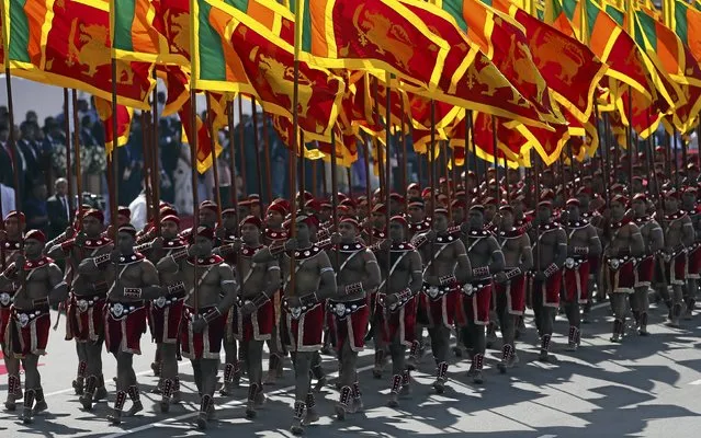 Members from Sri Lankan military march wth national flags during Sri Lanka's 68th Independence day celebrations in Colombo, February 4, 2016. (Photo by Dinuka Liyanawatte/Reuters)