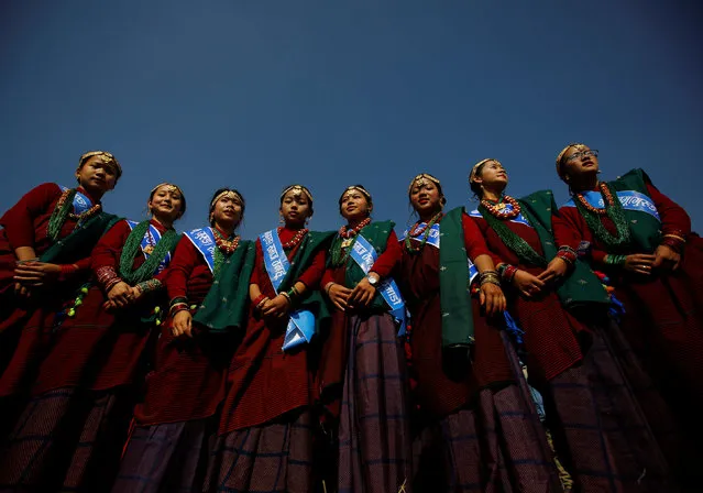 Gurung girls wearing traditional costumes pose for a picture while taking part in the Tamu Lhosar or Losar (New Year) parade in Kathmandu, Nepal December 30, 2016. (Photo by Navesh Chitrakar/Reuters)