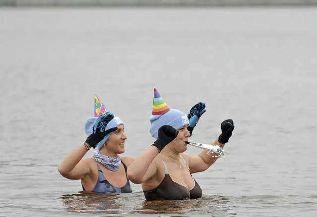 Winter swimming fans welcome the New Year in the icy waters of the Zalew Zegrzynski lake in Nieporet, Poland, Sunday, January 1, 2017. (Photo by Alik Keplicz/AP Photo)
