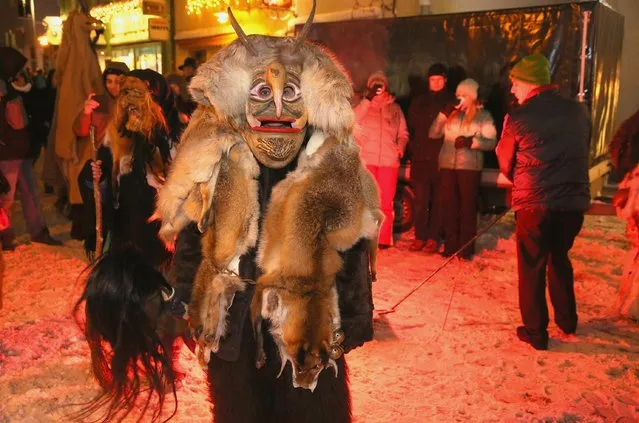 Locals dressed as “Perchten”, a traditional demonic creature in German and Austrian Alpine folklore, parade through the town center during the annual “Rauhnacht” gathering on January 5, 2017 in Waldkirchen, Germany. (Photo by Johannes Simon/Getty Images)