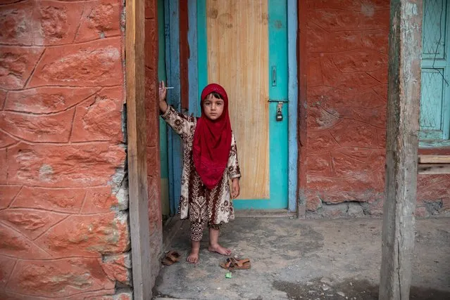 A girl poses for a picture inside school premises in Dawar, Gurez. Gurez lies along the LOC (Line of Control) in northern part of Kashmir on July 22, 2021. The people in Gurez are the Dard-Shins with their ancestry living in Gilgit in Pakistan. The features and attire of the Dard are similar to the Kashmiris. (Photo by Idrees Abbas/SOPA Images/Rex Features/Shutterstock)