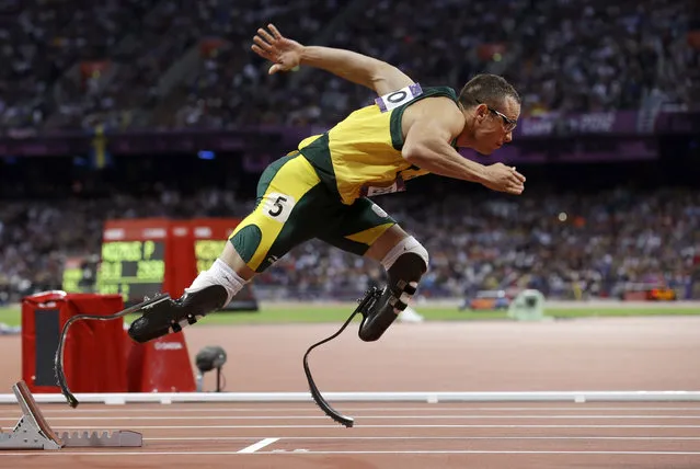 In this Sunday, August 5, 2012 file photo South Africa's Oscar Pistorius starts in the men's semi-finals of the 400-meter in the Olympic Stadium at the 2012 Summer Olympics, London.  Pistorius could be granted parole on Friday, Nov. 24, 2023 after nearly 10 years in prison for killing his girlfriend. The double-amputee Olympic runner was convicted of a charge comparable to third-degree murder for shooting Reeva Steenkamp in his home in 2013. He has been in prison since late 2014. (Photo by Anja Niedringhaus/AP Photo)